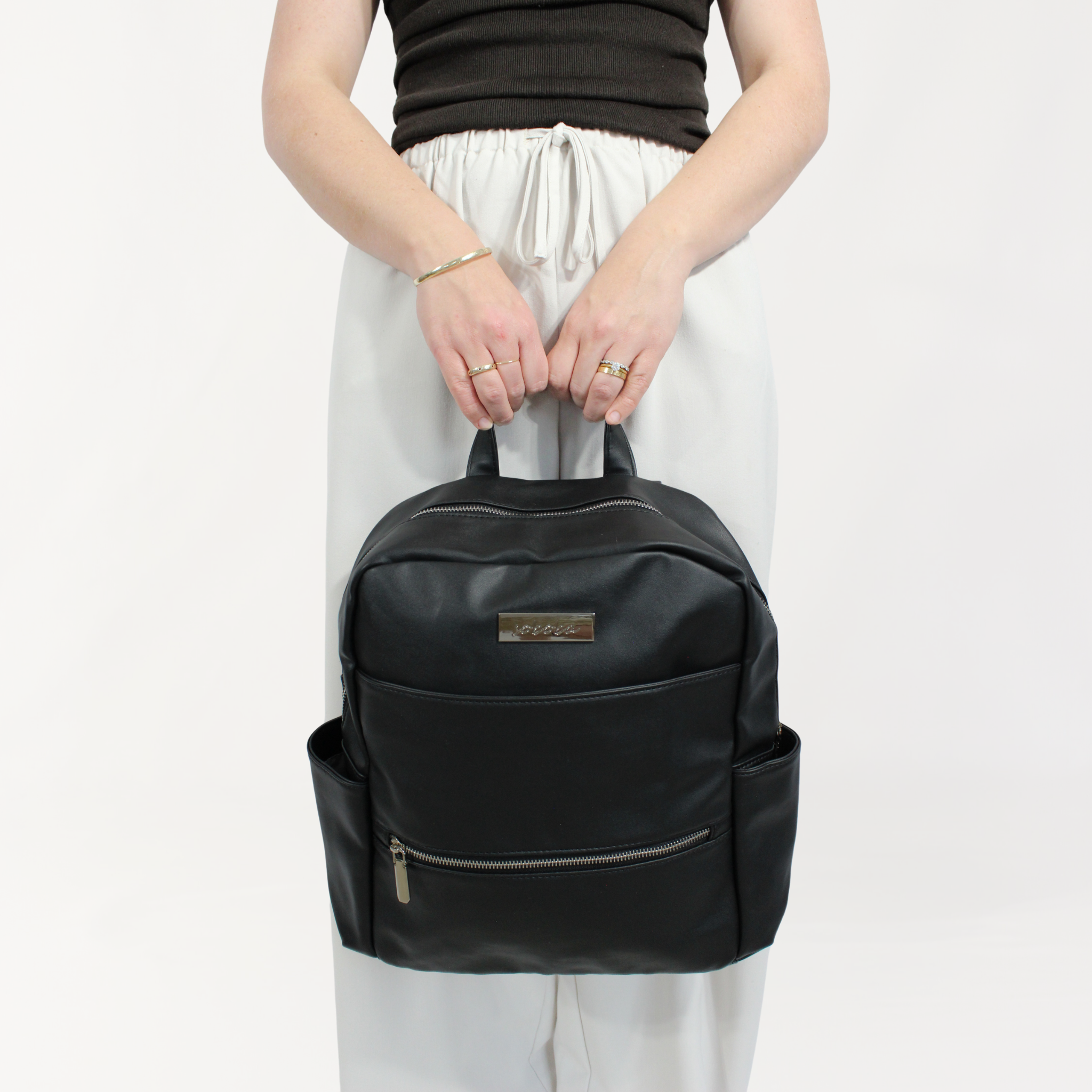 Remmii Carter Nappy Backpack in Black, Front View With Person