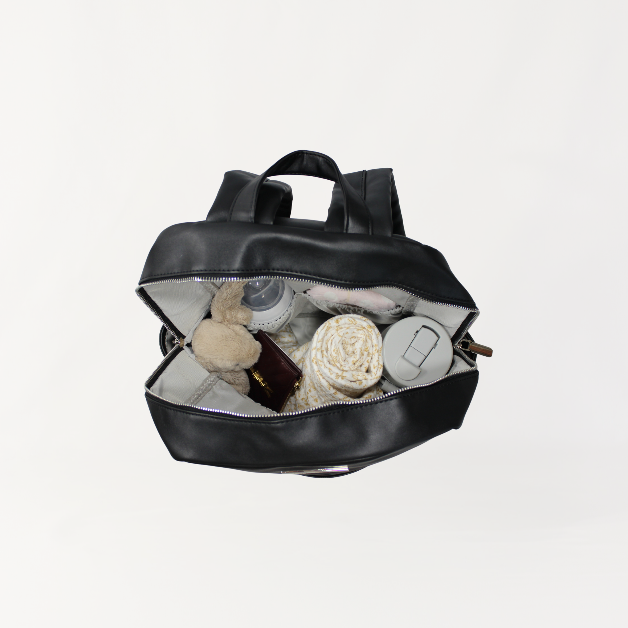 Remmii Carter Nappy Backpack in Black, Bag Is Packed Shown In Top View