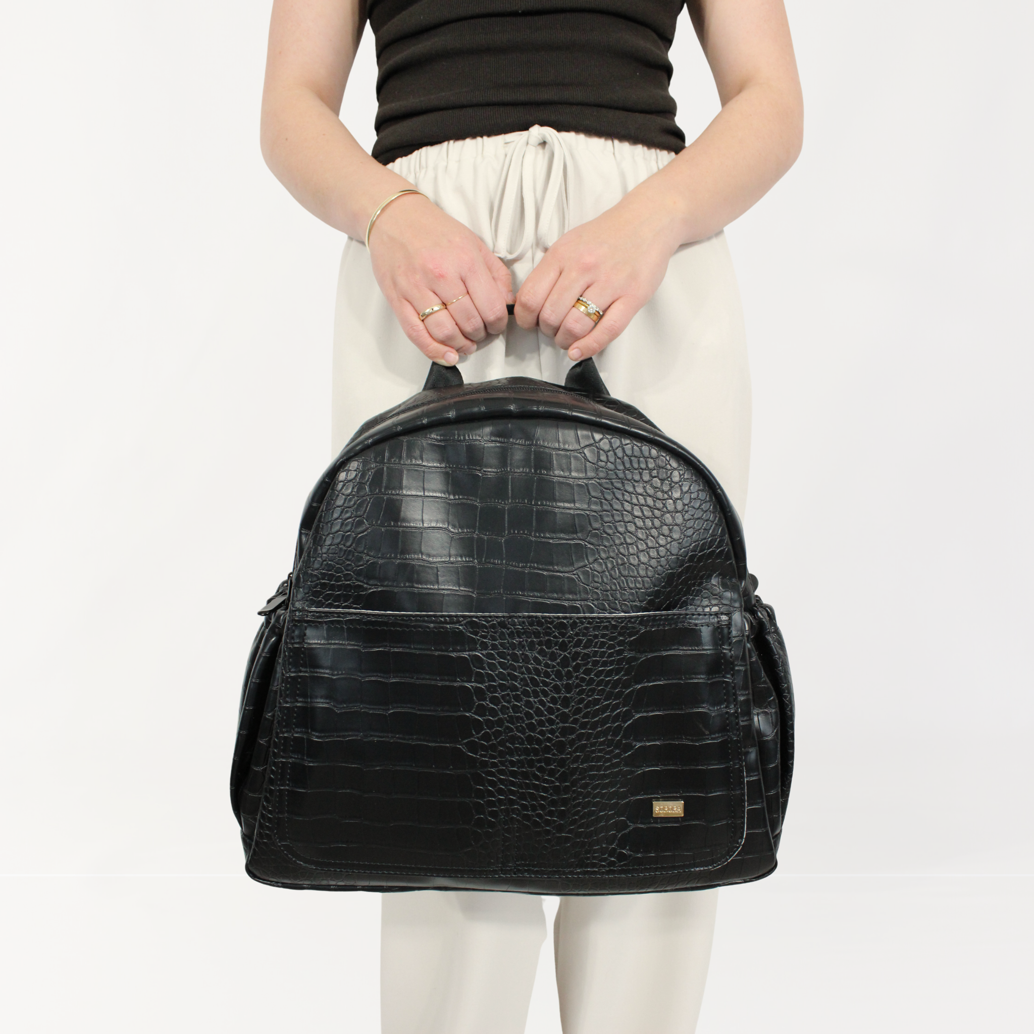 Remmii Emerson Nappy Backpack in Black Croc, Front View With Person