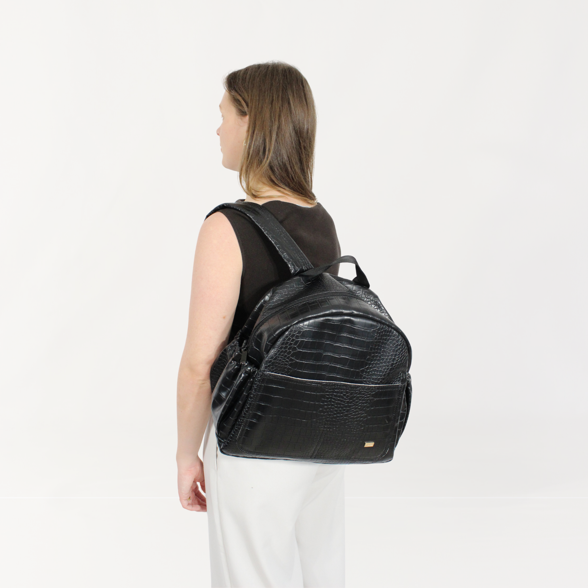 Remmii Emerson Nappy Backpack in Black Croc, Being Worn Over One Shoulder