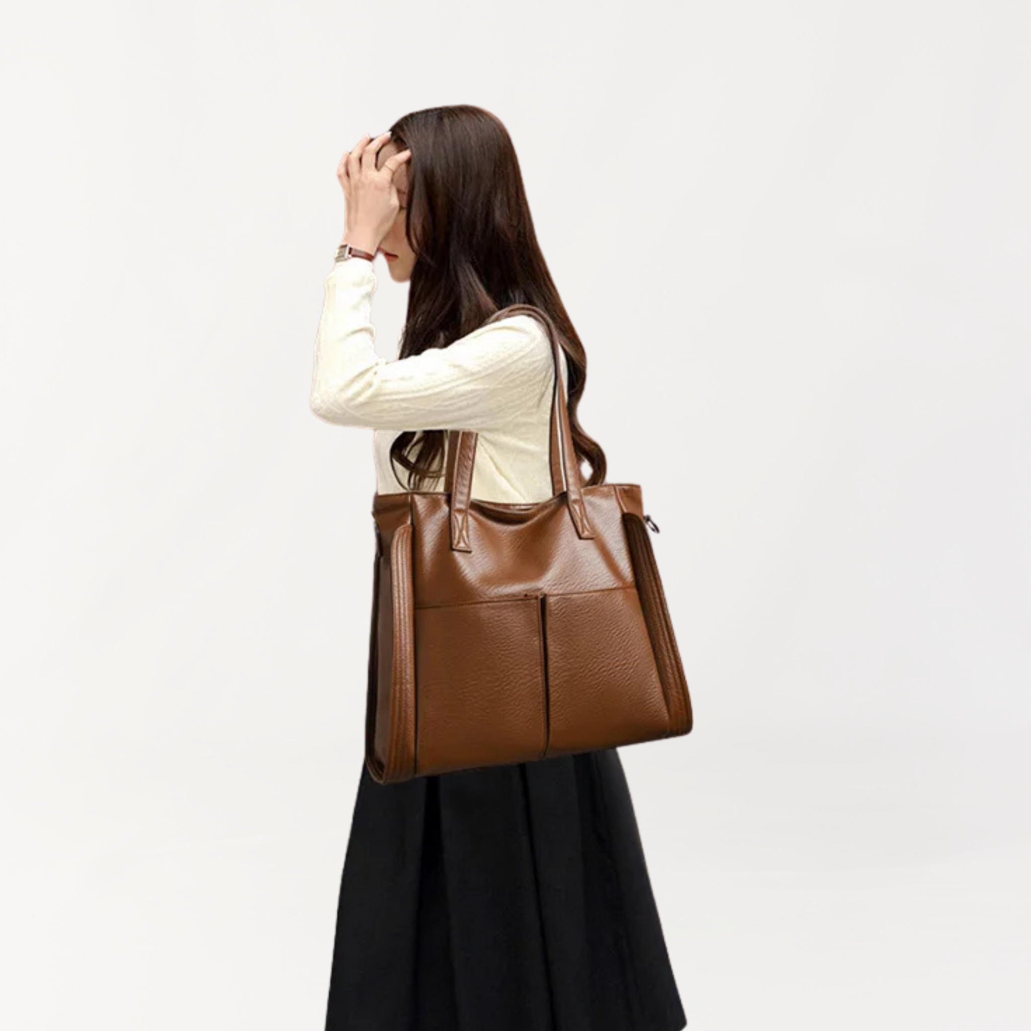 Remmii Harper Baby Tote in Tan, Being Worn Over One Shoulder