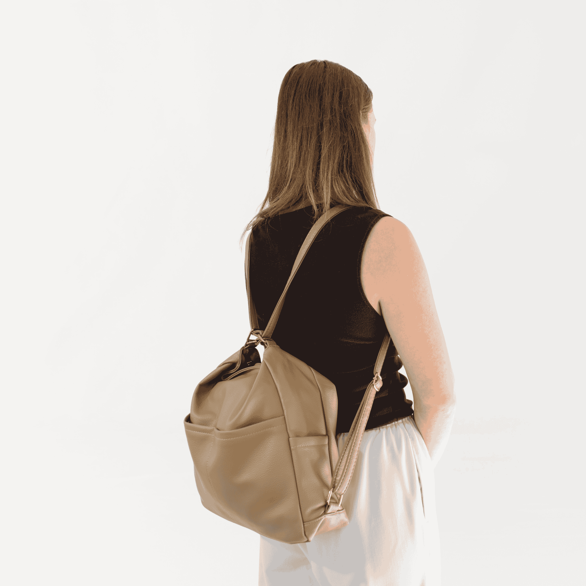 Remmii Noah Baby Tote in Tan, Being Worn As Backpack