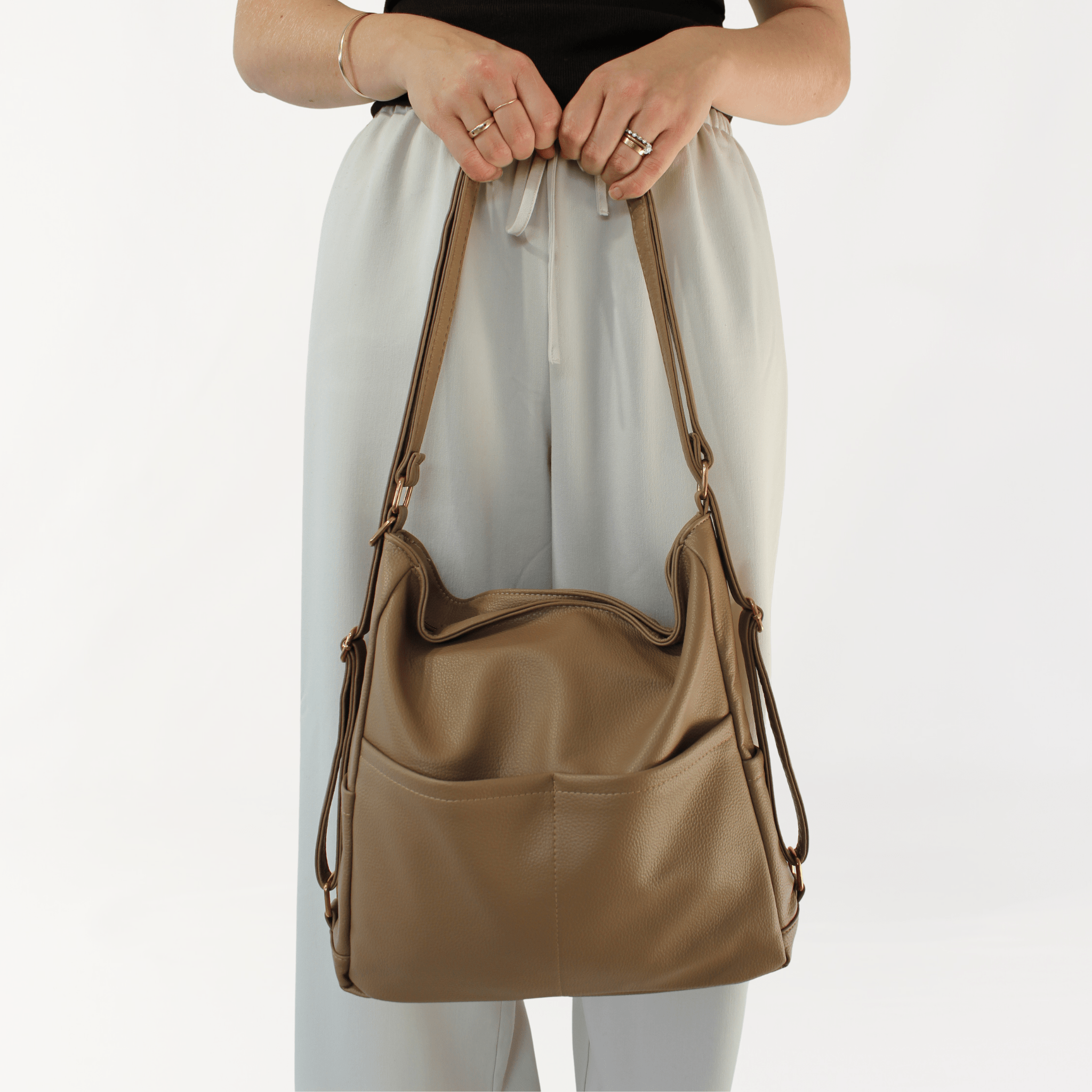 Remmii Noah Baby Tote in Tan, Front View With Person