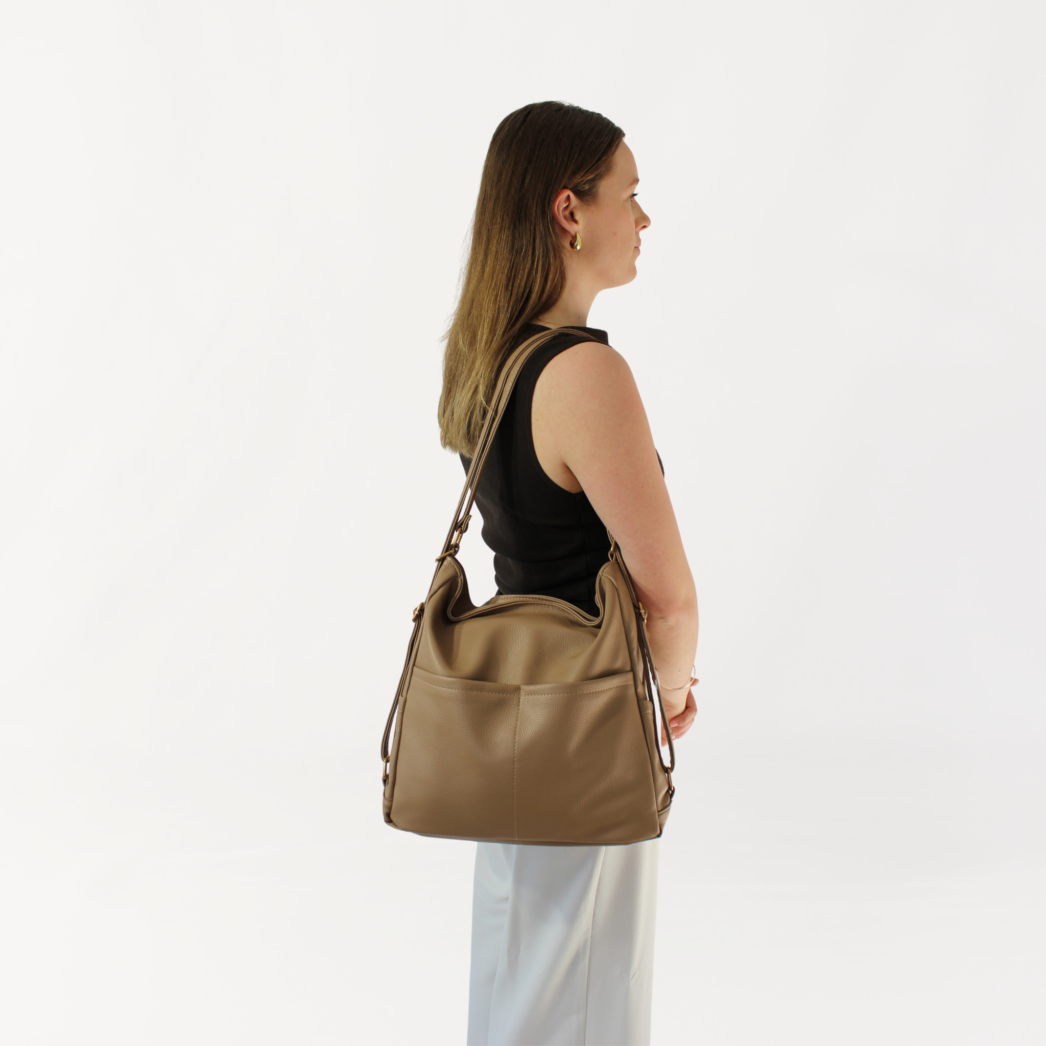 Remmii Noah Baby Tote in Tan, Being Worn Over One Shoulder From Side View
