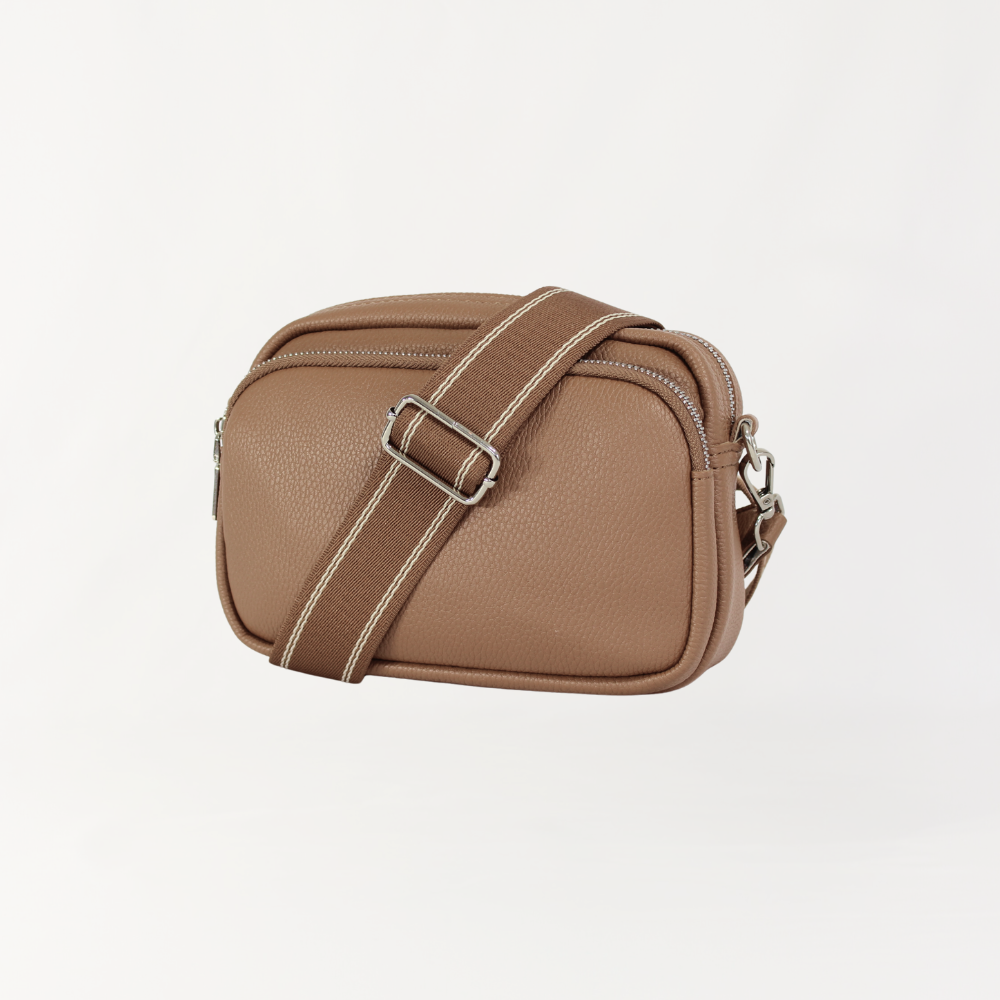 Remmii Riley Crossbody Baby Bag in Almond, Front View Strap Over Bag Angle