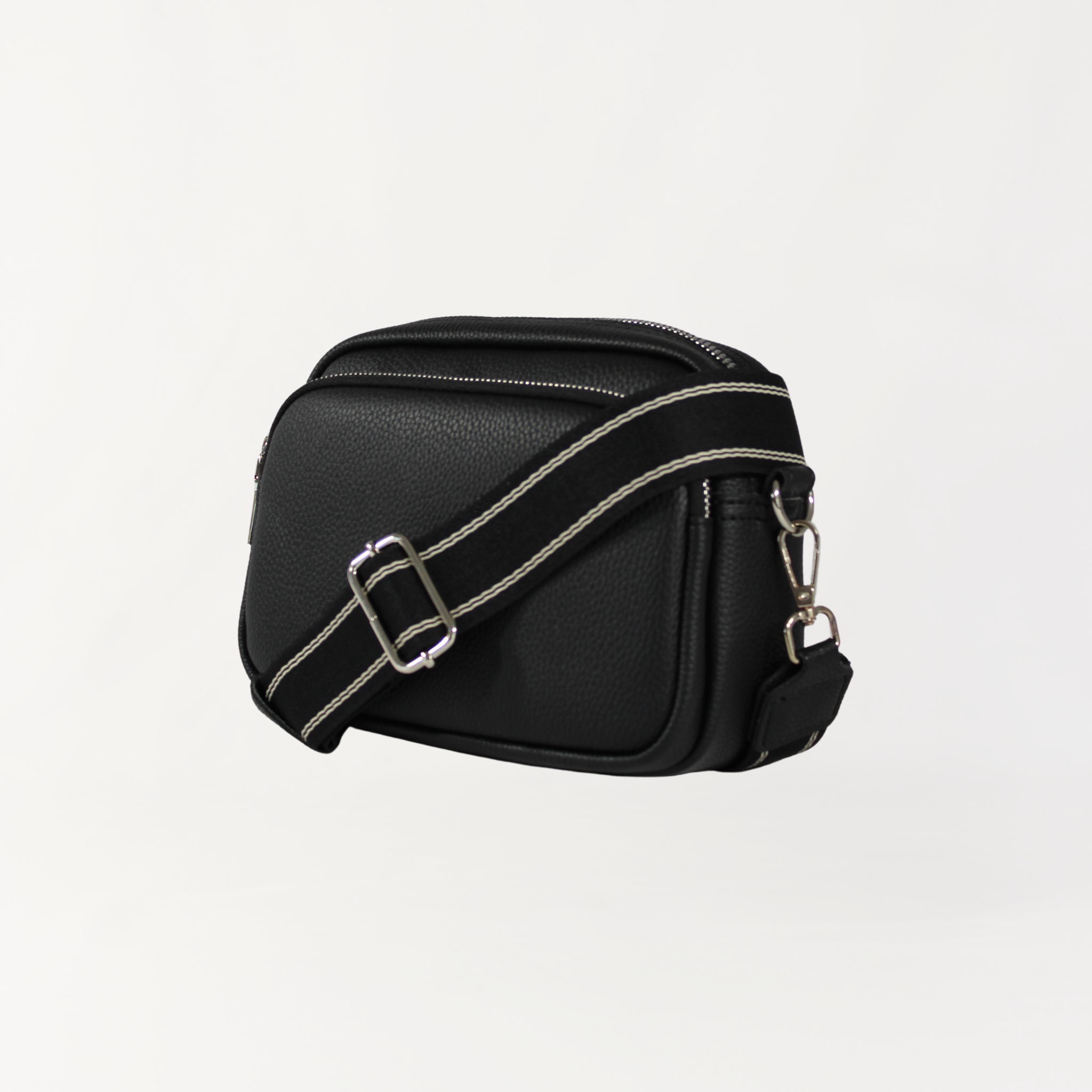 Remmii Riley Crossbody Baby Bag in Black, Angle View Of Strap