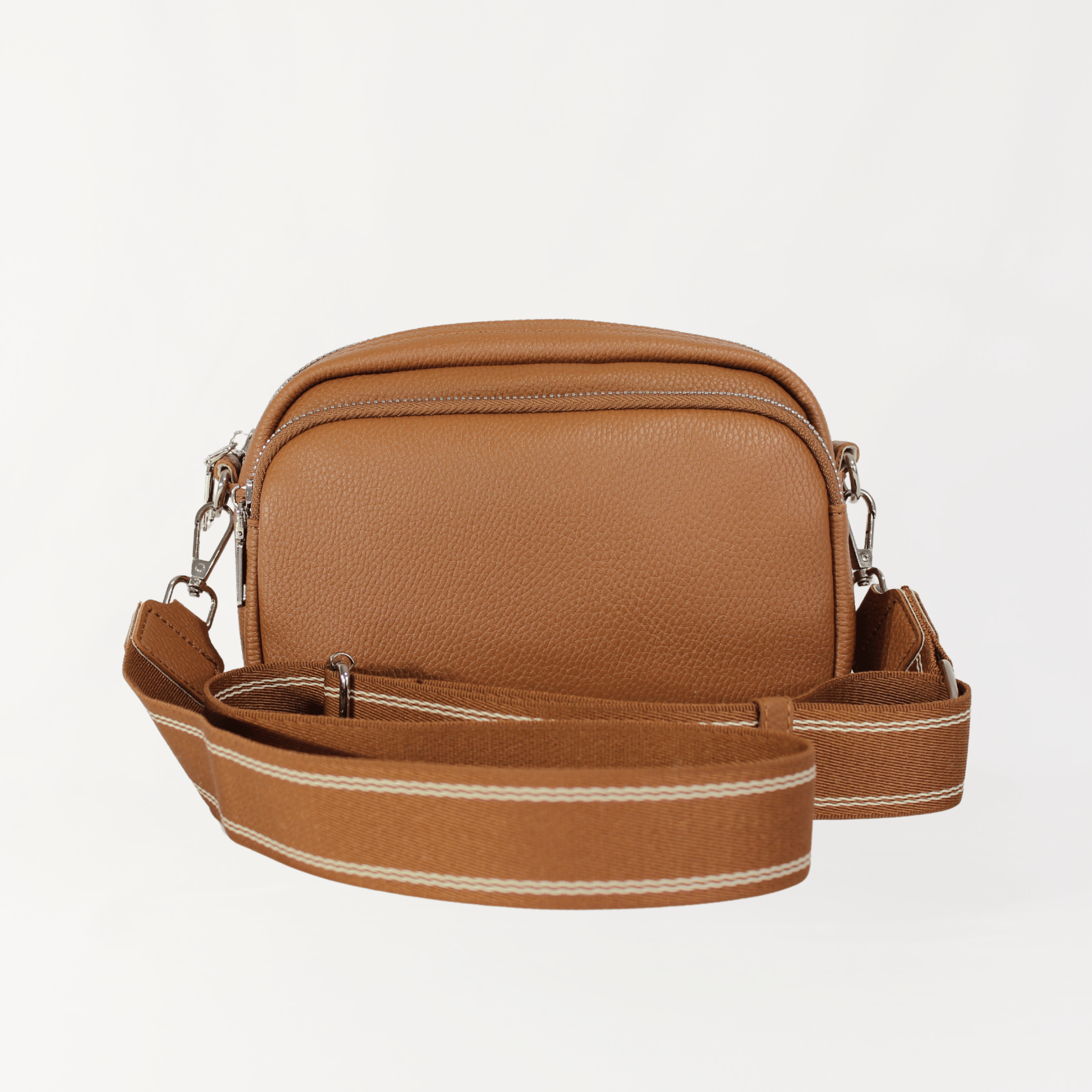 Remmii Riley Crossbody Baby Bag in Caramel, Front View With Straps