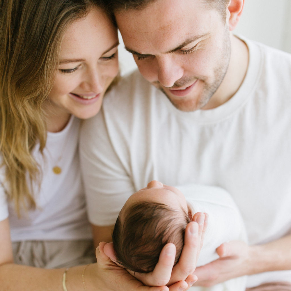 Remmii Team Holding baby