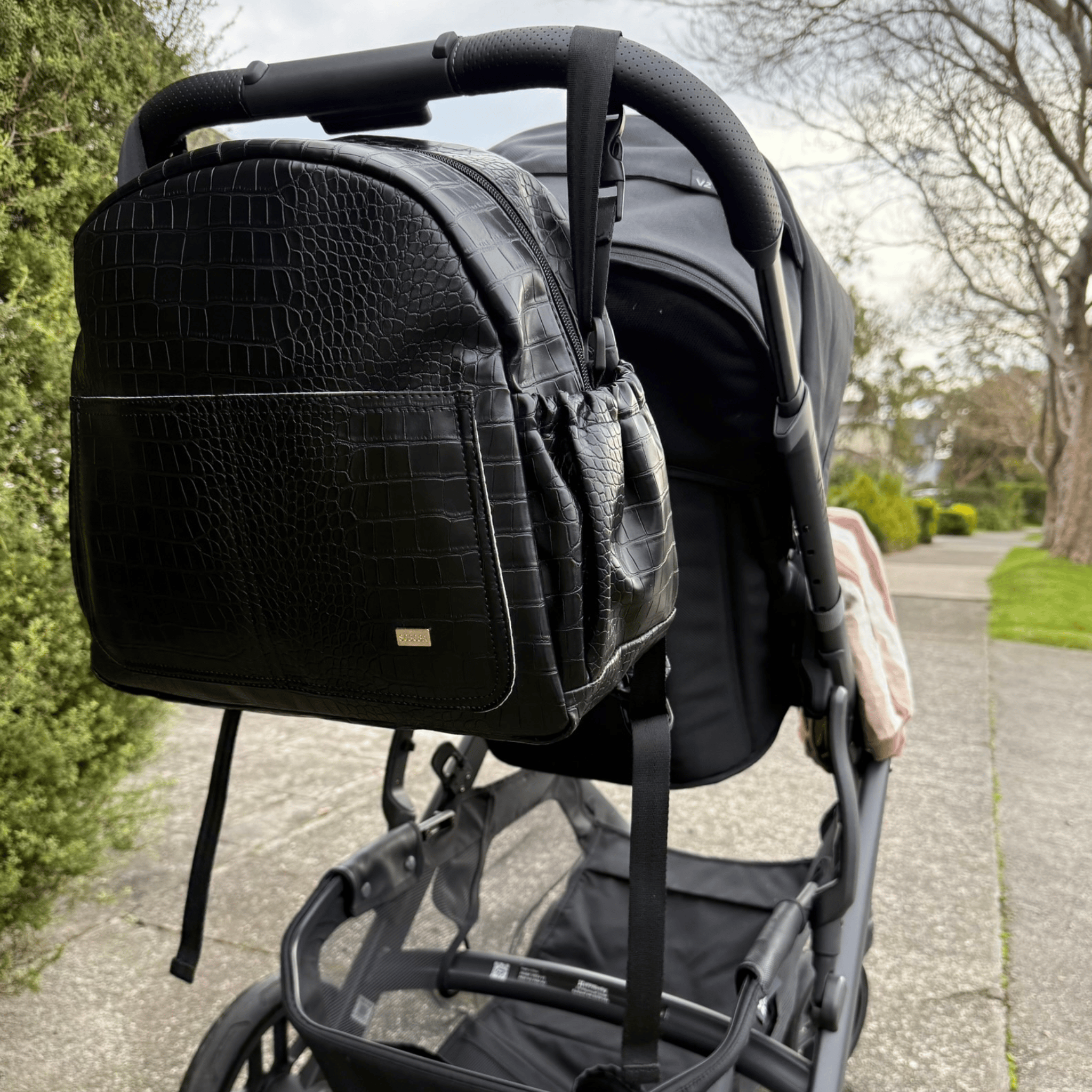 Remmii Emerson Nappy Backpack in Black Croc, Attached To Pram With Stoller Straps