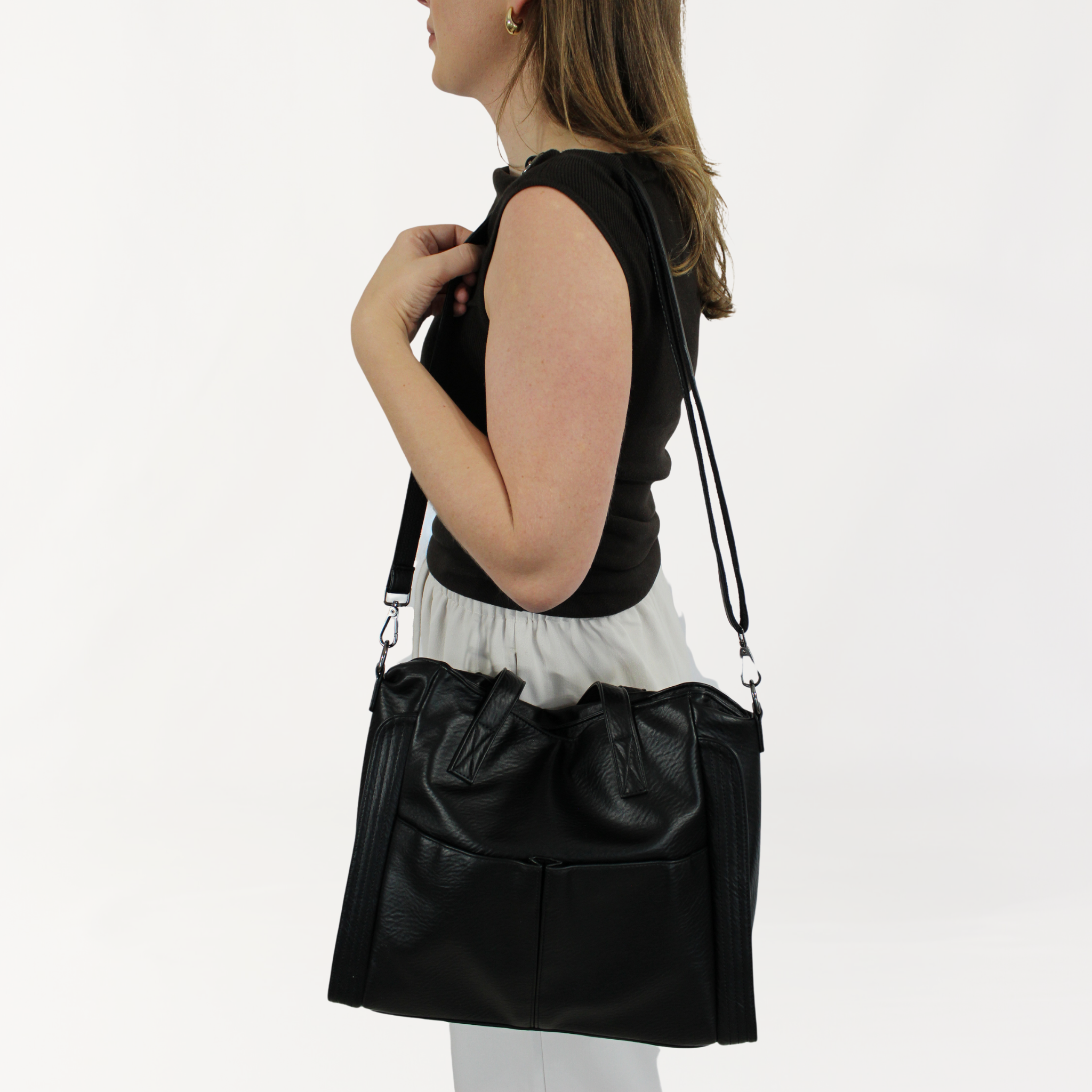 Remmii Harper Baby Tote in Black, Being Worn Over One Shoulder