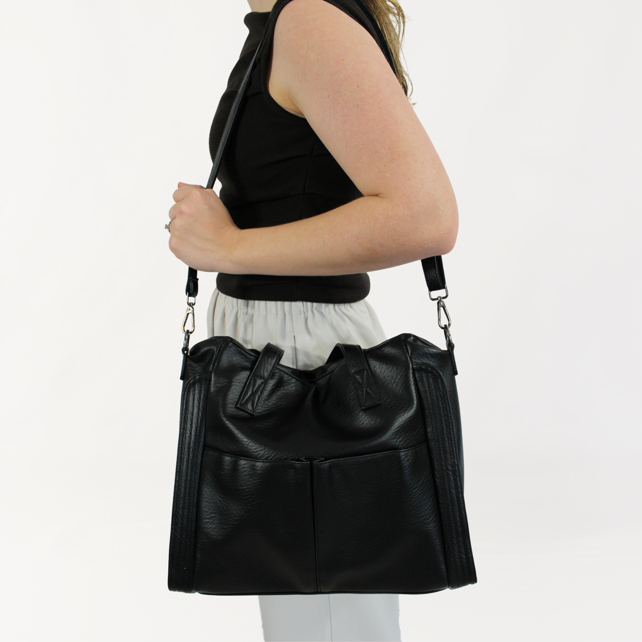 Remmii Harper Baby Tote in Black, Being Worn Over One Shoulder Close Up