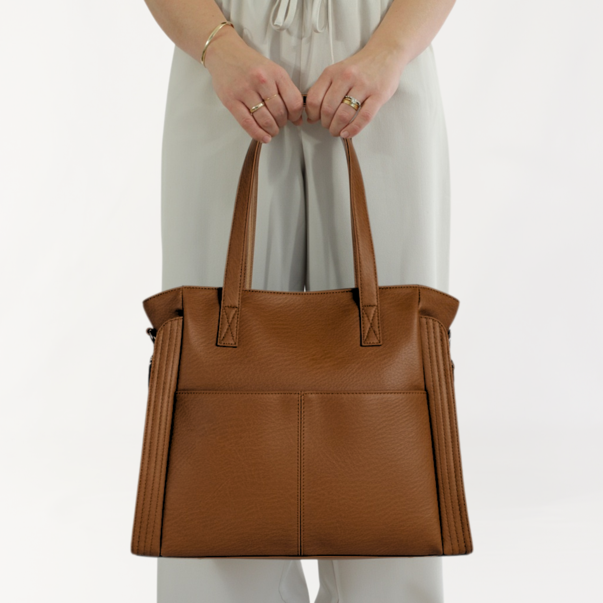 Remmii Harper Baby Tote in Tan, Front View With Person