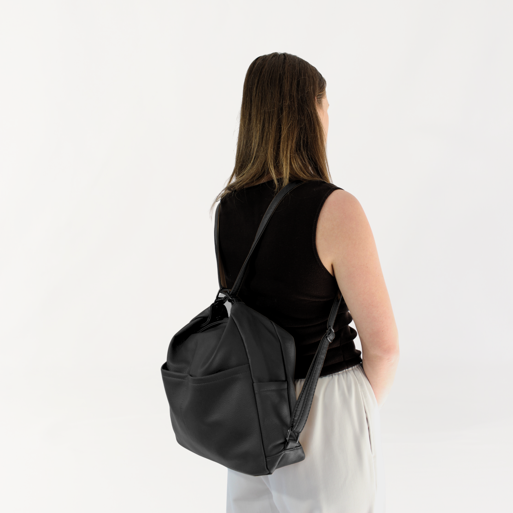 Remmii Noah Baby Tote in Black, Being Worn As Backpack