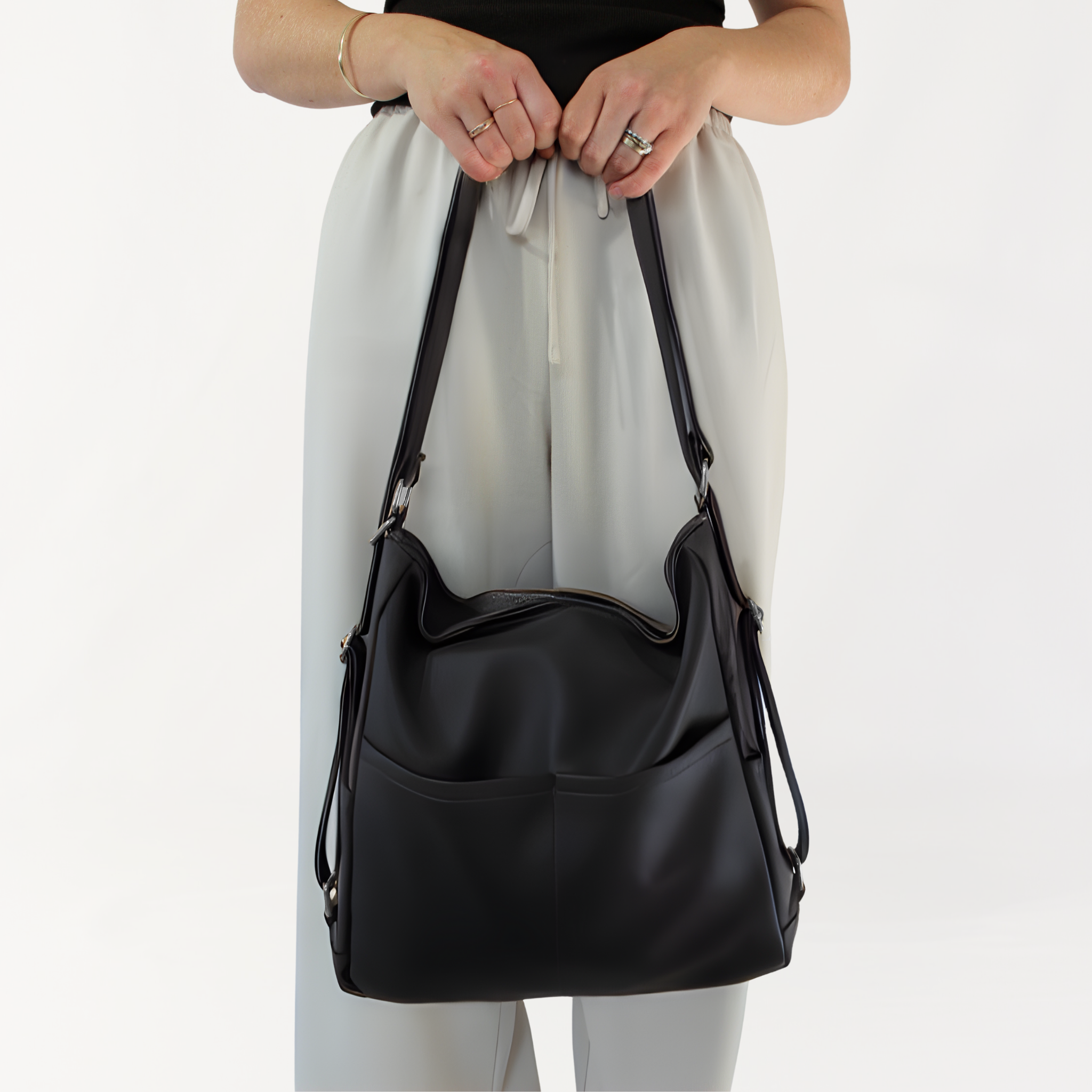 Remmii Noah Baby Tote in Black, Front View With Person