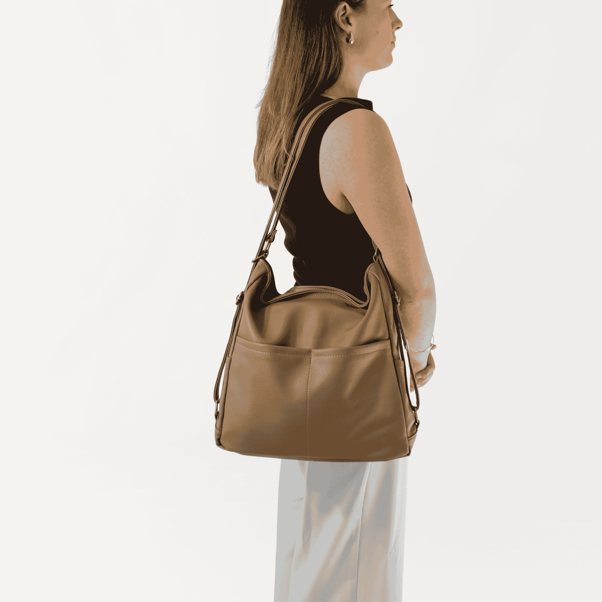 Remmii Noah Baby Tote in Tan, Being Worn Over One Shoulder Side View