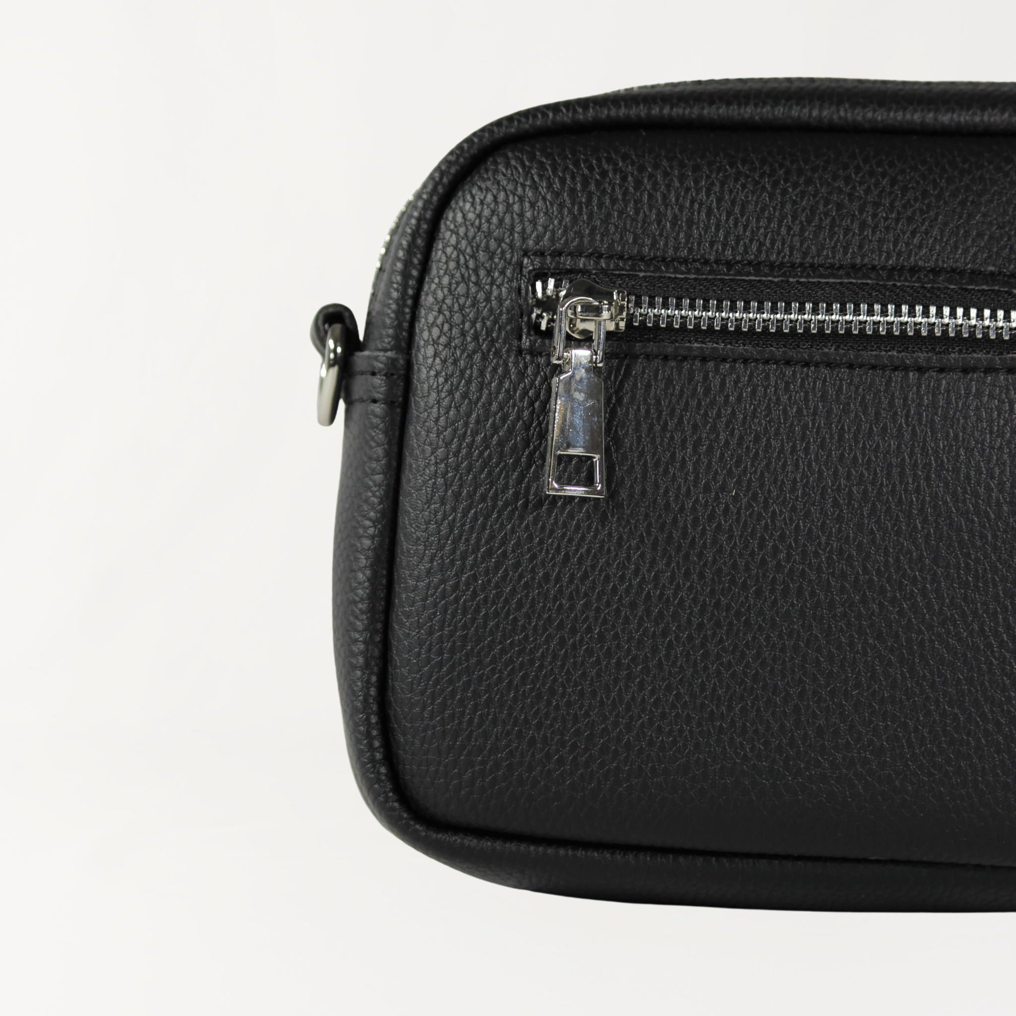 Remmii Riley Crossbody Baby Bag in Black, Close Up View Of Back